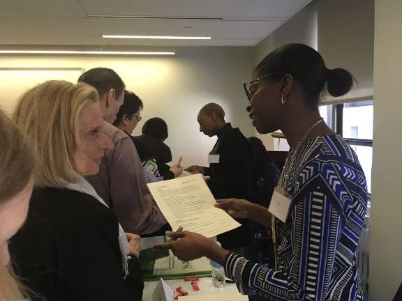 A Citibank representative reviews a participant’s resume. The bank has openings for tellers at multiple locations and often promotes from within. Photo: Megan Conn