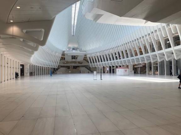 The Oculus, designed by Calatrava, was completely empty at 11 a.m. This is a space for people going from the subway, PATH and passageways to their destination. Retail stores were closed, with city police and state police outnumbering pedestrians.