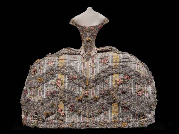 This elaborate doll's dress, decked out with ruffles and spangles (and a frightening hip-to-waist ratio) would have been used by traveling dressmakers. Photo: Adel Gorgy