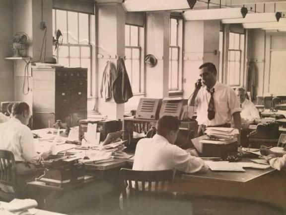 The Daily News's City Room in the early 1950s. Standing is longtime press agent, publicist and political fixer Morty Matz, then an assistant picture assignment editor at the paper. Photo: Collection of Morty Matz