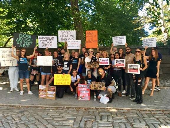 Animal rights activists gathered in front of the Guggenheim Museum on Sept. 23 to protest the planned exhibition of controversial works of art involving animals. Photo: Edita Birnkrant