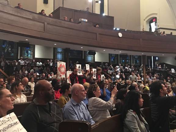 Several hundred people rallied last week at the New York Society for Ethical Culture to advocate for divestment from &quot;dirty energy,&quot; protection against climate change and more environmentally friendly jobs.&#xa0;Photo: Madeleine Thompson