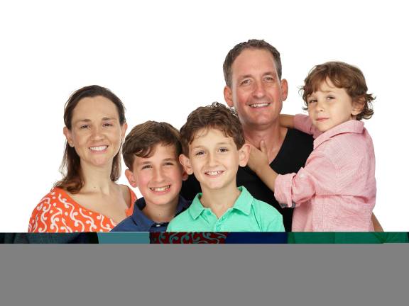 Joanna and Michael Droege, pictured with their sons Logan, now 13; Holden, 11, and Jack, 6, are in India to participate in a rickshaw race through which they hope to raise funds for arts programming in city schools. Photo: Peter Hurley, peterhurley.com
