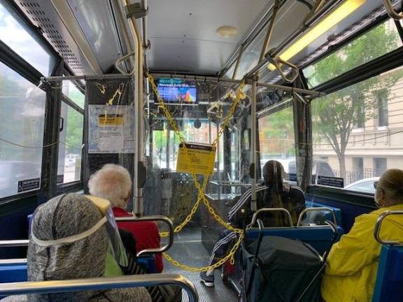 I got off at 72nd Street, and the last leg of my trip uptown was on the M5 bus. The vinyl divider, shown here, is to keep the driver away from most riders to prevent catching the virus; the front of the bus is reserved for mobility-challenged passengers.