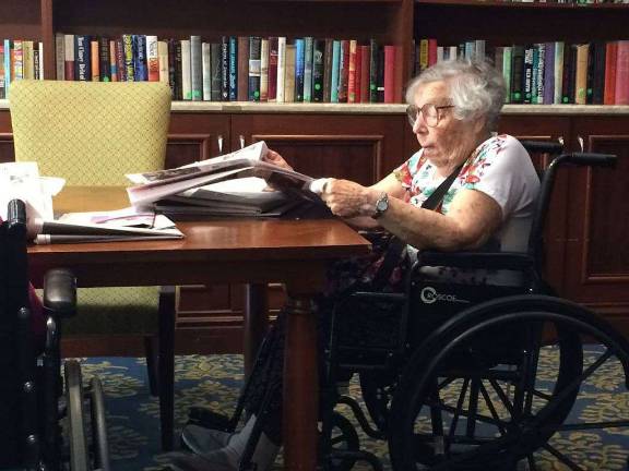 Scoping out the news at the Brookdale Battery Park library.
