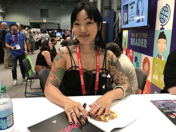 Heather Kim signs copies of her cookbook “Sweet Revenge.” Photo: Alizah Salario