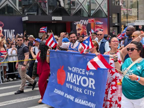Puerto Richan Day Parade, Tricia Shimamura in green, Mayor in Knicks jersey in tie.