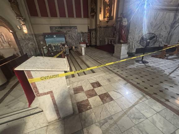 An area to the left of the main altar inside Most Holy Redeemer is blocked off by yellow caution tape, indicating there may be some structural issues besetting the 174-year-old church, built by 19th-century German immigrants.