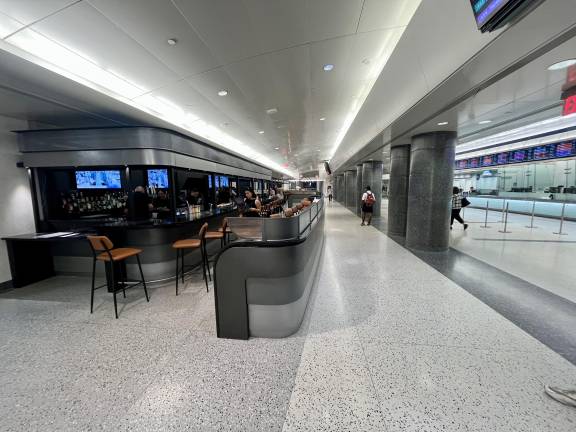 The long bar space at Tracks Raw Bar and Grill blends in very well with the LIRR ticket office across the way. There are two adjoining spaces, one on either side of the bar to have a business meeting, family gathering, or just some zen moments to sample the menu for food and drink.