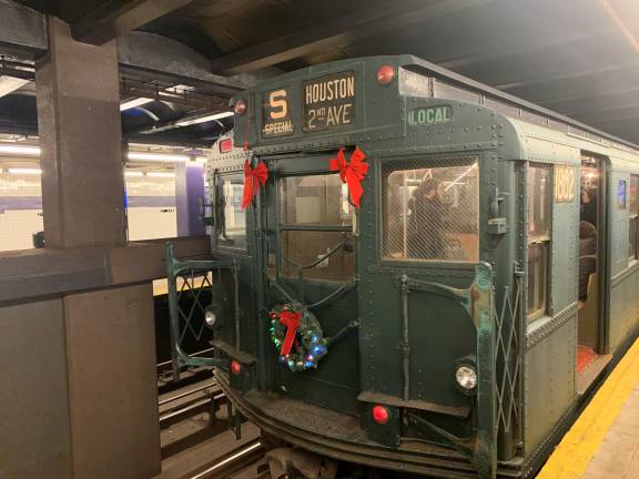 Festooned with holiday ornaments, the Nostalgia Train awaits another trip north at the Second Avenue and Houston Street station on the F line. The first round trip and the last one of the day tend to be the least crowded.