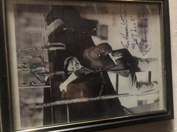 <b>Katherine Hepburn who co-starred with Spencer Tracy in nine movies and was said to be blindingly in love with him for decades, sent Lorcan Otway’s father, Howard, this photo of herself climbing onto a yacht owned by Tracy. It is one of dozens of autographed photos from Hollywood and Broadway stars that line the walls of Theatre 80</b>. Photo of the photo: Keith J. Kelly
