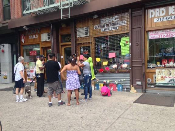 People gathered at BNC General Merchandise, on Amsterdam between 104th and 105th streets on Friday afternoon. Photo: Richard Khavkine