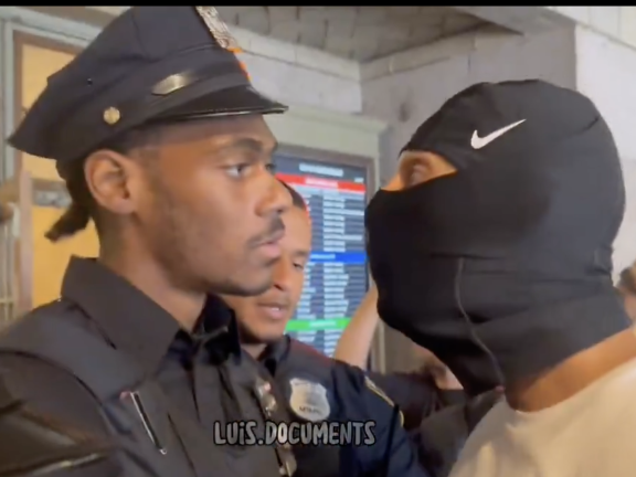 Cop meets sheisty-masked antagonist.