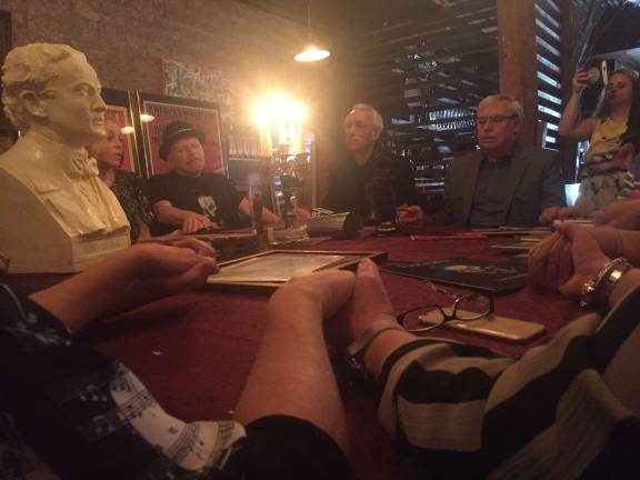 Magicians and magic fans held hands to create an energy for Houdini to make his presence known. Photo: Carson Kessler