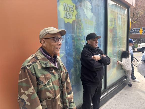 Miguel (far right), a patron of Sal’s deli said he’d often sit for hours enjoying coffee with worker Abdul Saleh. Emory (left) said he’d often sweep up outside the store.
