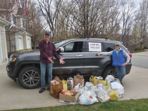 Wantage residents Fred Fogle and Aileen Donovan organize a neighborhood food drive.