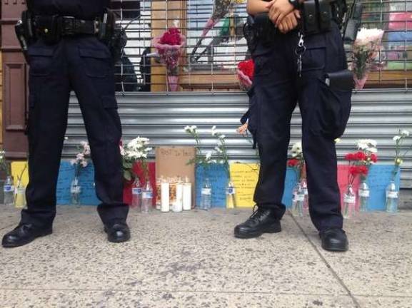 A makeshift memorial last June for Bubacarr Camara, a 26-year-old shopkeeper killed during a robbery of his father's Amsterdam Avenue store. Two of three men accused in his killing have pleaded guilty to federal charges. Photo: Richard Khavkine