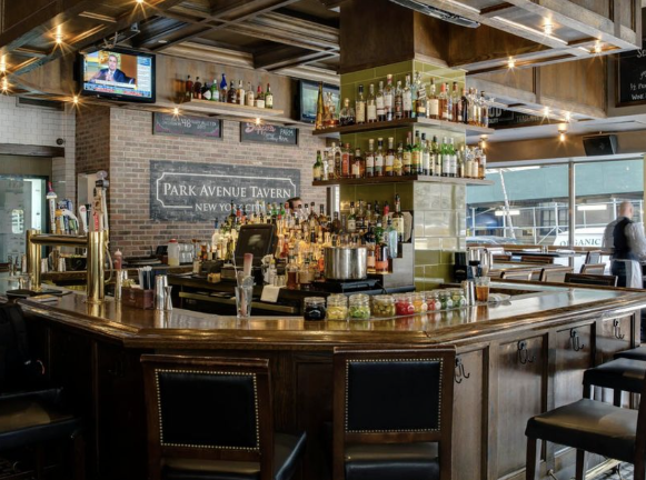 Park Avenue Tavern interior is well lit and its unusual layout is such that many customers have met their future spouse while enjoying a relaxing drink at the bar.