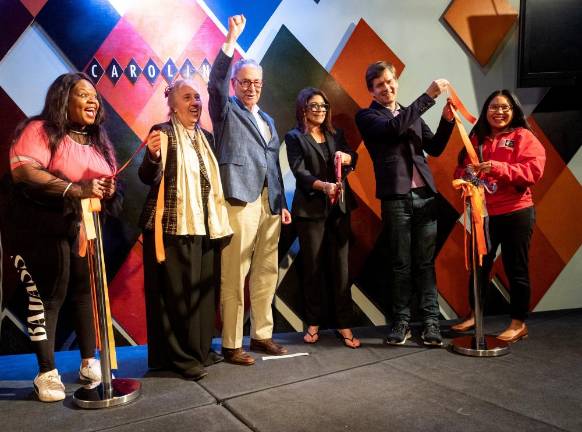 At the ribbon-cutting for Carolines on Broadway re-opening on May 31, 2021. From left to right: comedian Yamaneika Saunders; Manhattan Borough President Gale Brewer; U.S. Senator Chuck Schumer; owner of Carolines on Broadway Caroline Hirsch; State Senator Brad Hoylman; and Senior VP and Chief of Staff of Times Square Alliance Regina Fojas. Photo: Diane Bondareff