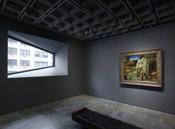 Room 13: Bellini’s “St. Francis in the Desert,” one of the Frick’s most important and loved works, is displayed in isolation, paired with one of the iconic trapezoidal windows Marcel Breuer conceived for the building. Photo: Joe Coscia