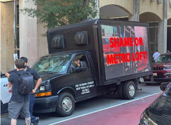 The Carpenters Union stationed a truck with the sign “Shame on Metro Loft” at Second Ave. and E. 43rd St. on July 8 to call attention to the developer who is converting an office tower to residential housing with a largely non-union workforce.