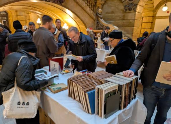 A book table in the glow of vintage Hall of Records mood lighting.