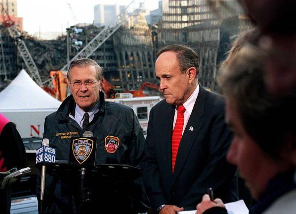 A somber Giuliani at Ground Zero with Defense Secretary Donald Rumsfeld in Nov. 2001. His performance as a leader in the wake of 9/11 earned him the title America's Mayor.