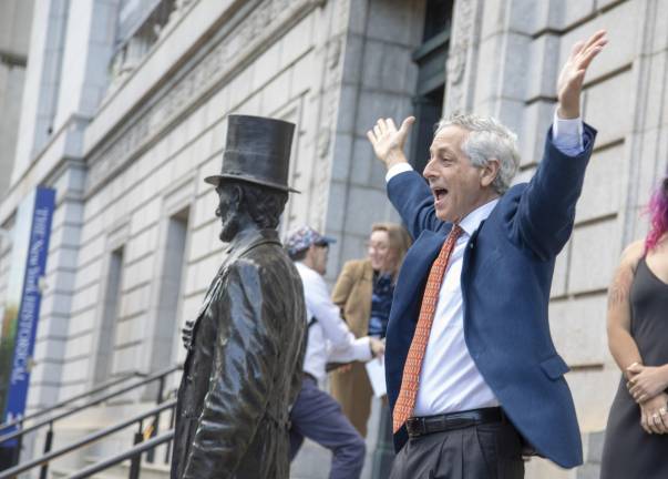 A guest greets protesters while entering Transportation Alternatives’ annual fundraiser at the New-York Historical Society.