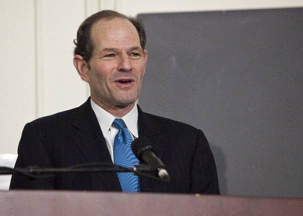 Eliot Spitzer, seen here in a 2009 lecture a year after a call girl scandal forced him to step down as NYS governor, briefly logged into a CB8 meeting on Oct. 20 where the real estate firm he heads, Spitzer Enterprises was outlining plans to add an additional floor to a new building he plans to erect after demolishing existing buildings at 985 Fifth Ave.