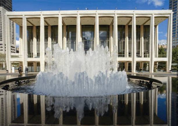 The <i>Revson Fountain</i> at Lincoln Center does double duty as a gathering place for those on their way to performances and as entertainment itself, for those with or without the price of a ticket.