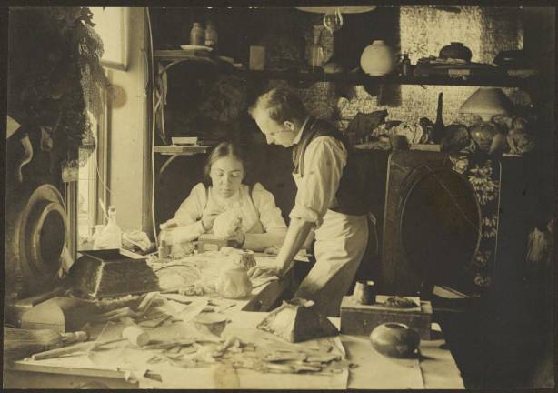 Clara Driscoll in her workroom at Tiffany Studios with Joseph Briggs, 1901. Courtesy, Department of American Decorative Arts, The Metropolitan Museum of Art, New York.