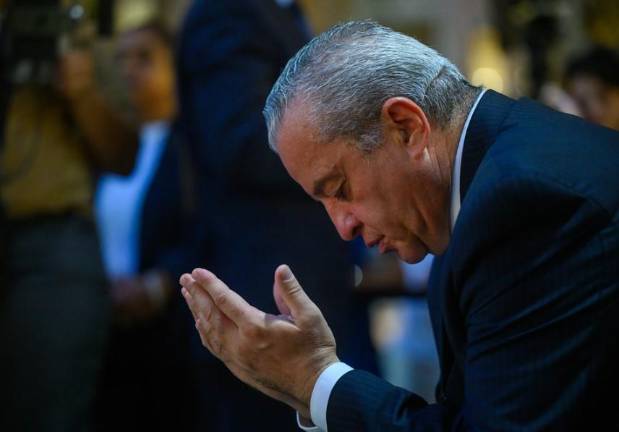 A city begins to mourn in a prayer service held in Bryant Park on July 29 for the four victims who were killed by a gunman who invaded a midtown office tower on July 28.
