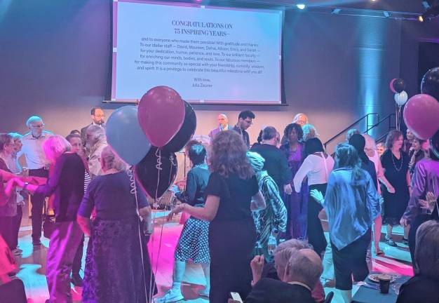 Guests dance the Twist at a Rock Around the Clock party at 92NY recently, celebrating the 75th anniversary of its Himan Brown program.