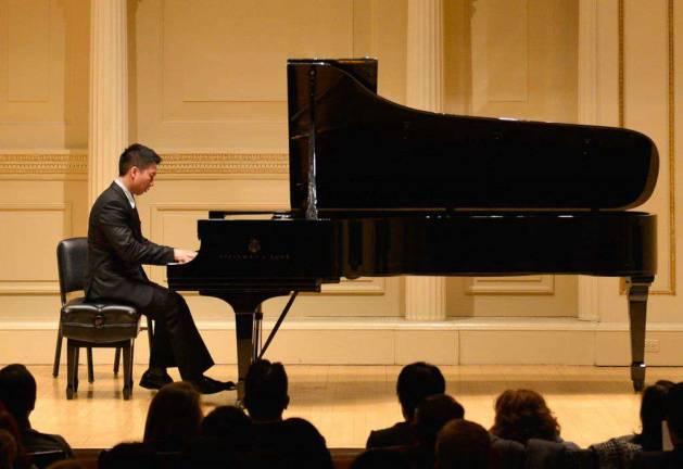 NYPD Sergeant Chris KaKit Yip performing with New York Piano Society at Carnegie Hall's Weill Recital Hall.