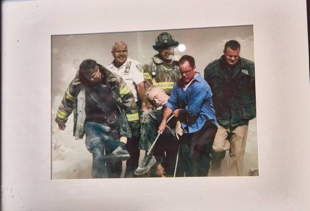 On display at the Fire Museum: the 9/11 photo by Shannon Stapleton of the body of FDNY chaplain Father Mychal Judge carried by firefighters Christian Vaughn and Zachary Vause; NYPD Lt. William Cosgrove; Kevin Allen of the Office of Emergency Management and civilian John Maguire from Goldman Sachs.