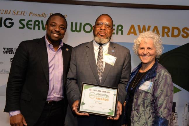 Super of the Year Troy Parker (center), with State Senator Brian Benjamin and Jeanne Straus.
