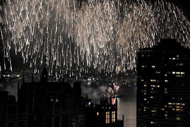 Fireworks displays, such as this shower of light that was visible from Tudor City on the East Side, will be visible once again as the Macy’s 4th of July fireworks moved back to the East River from the Hudson River where it was held last year.