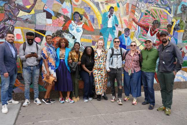 The Brixton-Harlem group in front of a local mural. Photo: Deborah Clark Fairfax