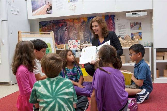 Commissioner Julie Menin with school kids. Photo courtesy of the NYC Office of Media and Entertainment