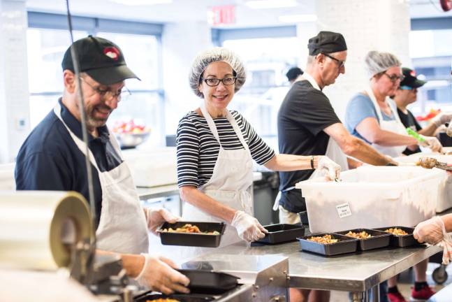 Preparing meals at God&#x2019;s Love We Deliver. Photo: Nicola Bailey