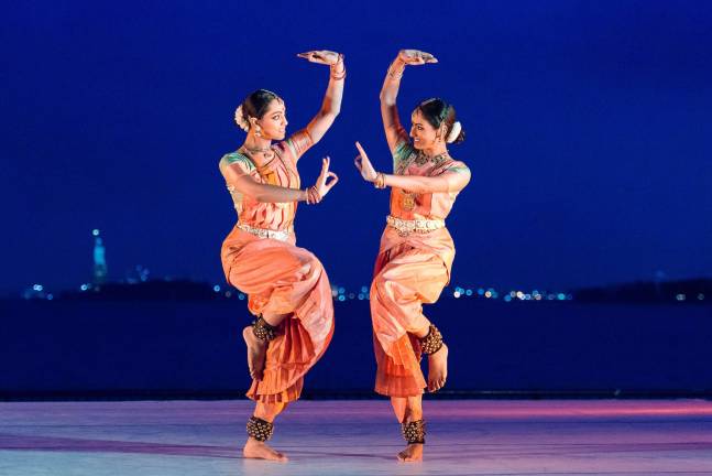 A recent performance in the Battery Dance Festival on the Esplanade of Robert F. Wagner Jr. Park in Battery Park City. The Statue of Liberty and New York Harbor provide the backdrop. Photo: Darial Sneed / Battery Dance