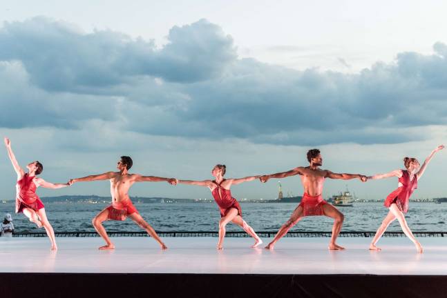 A recent performance in the Battery Dance Festival on the Esplanade of Robert F. Wagner Jr. Park in Battery Park City. The Statue of Liberty and New York Harbor provide the backdrop. Photo: Darial Sneed / Battery Dance