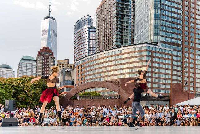 One World Trade Center and the lower Manhattan skyline provide the backdrop for a recent performance in the Battery Dance Festival on the Esplanade of Robert F. Wagner Jr. Park in Battery Park City. Photo: Darial Sneed / Battery Dance