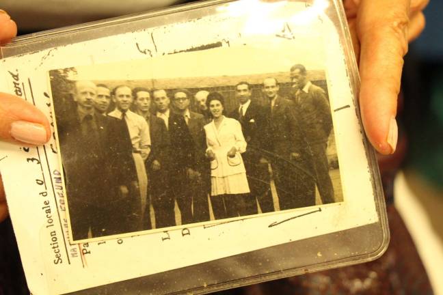 Mathilde Freund pictured in Lyon, France, on August 24, 1944, with 10 men to whom she had brought food and water every day as they hid from occupying German soldiers. Allied armies had liberated the city from German occupation that day. Photo courtesy of Mathilde Freund.