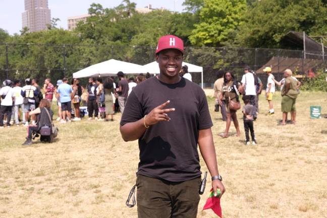 Jerrell Gray, organizer of As Black As It Gets! in front of food line. Photo: Beau Matic