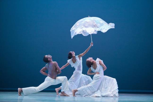 Alvin Ailey American Dance Theater's Kirven Douthit-Boyd, Alicia Graf Mack, and Demetia Hopkins-Greene in Revelations.