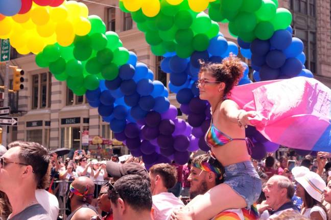 <b>The 53rd annual Pride Day March on June 25 commerates the Stonewall Riot when gays for the first time fought back against a police vice raid. The park acorss from the historic tavern now houses a national monument. But there was worry about the curtailing of LBGTQ rights among some of the revelers.</b> Photo: Beau Matic