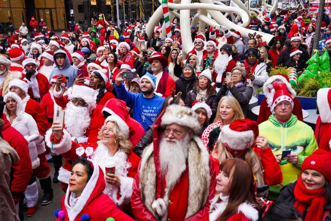 SantaCon attendees participate in the annual pub crawl in New York City on Saturday, Dec. 13, 2025.