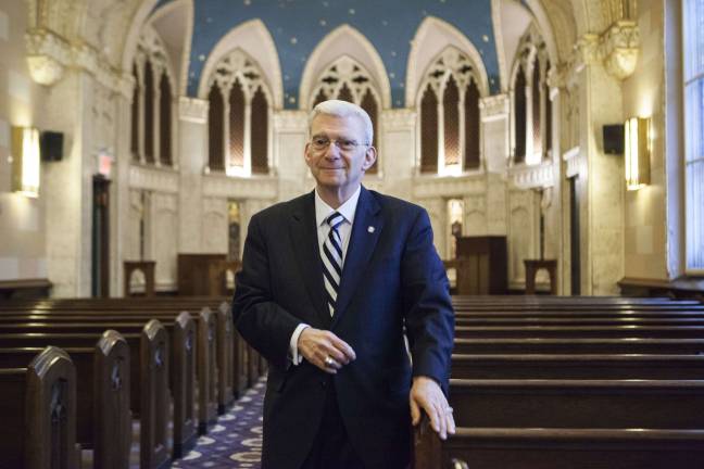 Charles Solomon at the Riverside Memorial Chapel, where he works to provide meaningful services for community members when they lose loved ones. Photo by Mary Newman