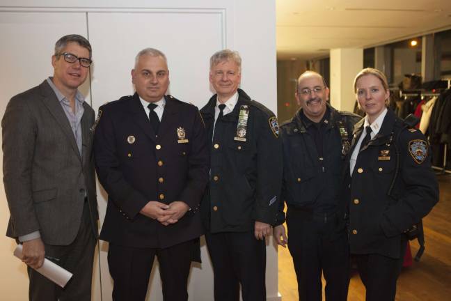 From left, West Side Spirit Editor-in-Chief Kyle Pope with WESTY Award winner Captain Michael Falcon of the 20th precinct, who was joined by fellow NYPD officers at the ceremony. Photo by Mary Newman